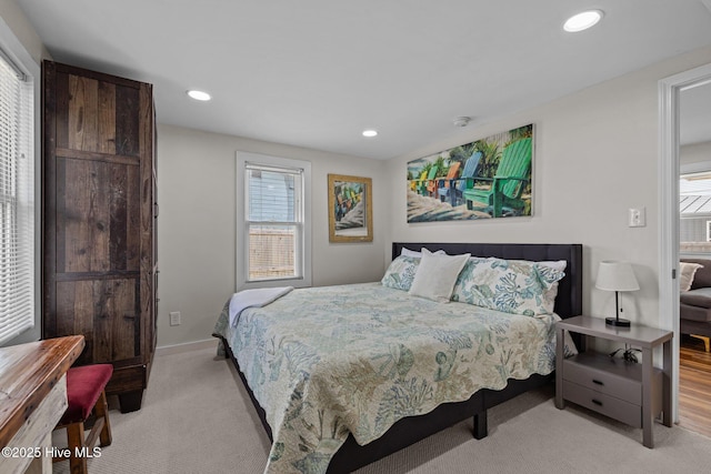 717 Cedar St Unit 1/2, Beaufort, NC 28516 - bedroom featuring multiple windows, light colored carpet, recessed lighting, and baseboards
