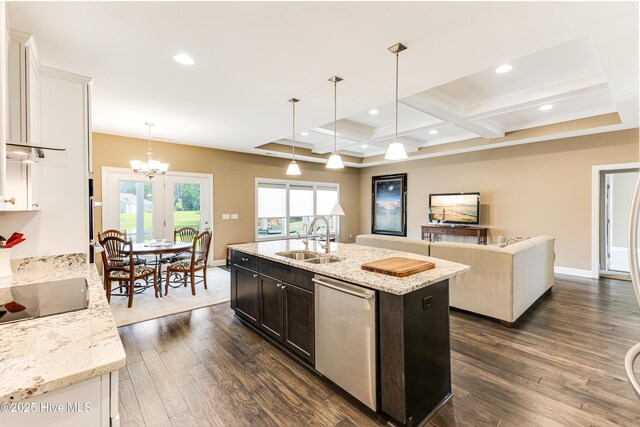 kitchen with a sink, dishwasher, a chandelier, dark wood finished floors, and black electric cooktop