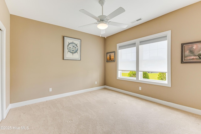 unfurnished room with carpet floors, ceiling fan, and baseboards