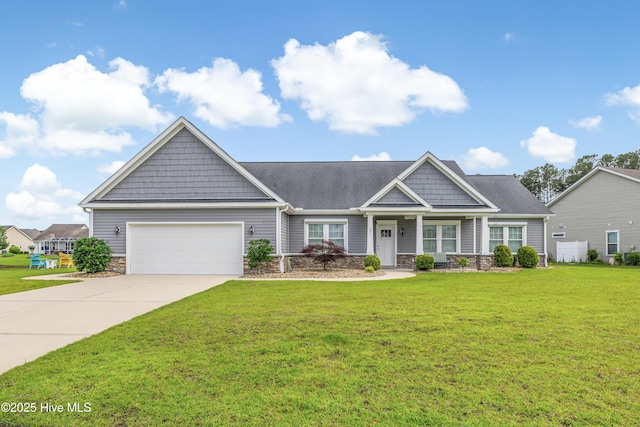 craftsman inspired home featuring stone siding, a garage, concrete driveway, and a front lawn