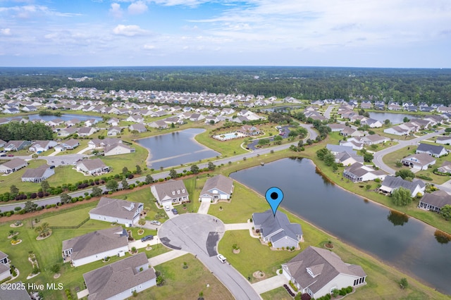 view of property location with nearby suburban area and a nearby body of water
