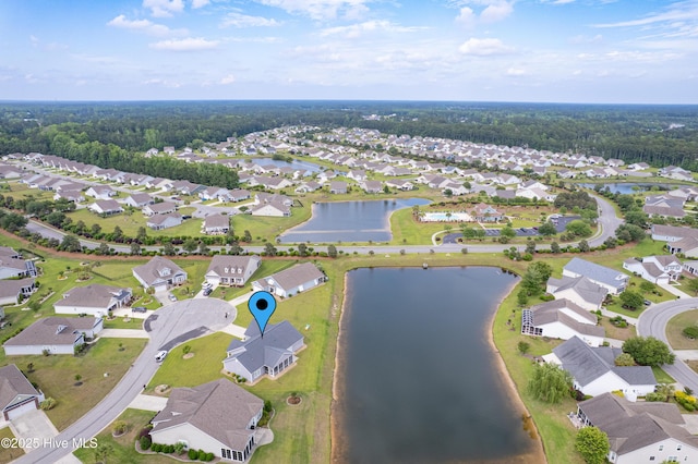 view of property location with nearby suburban area and a nearby body of water