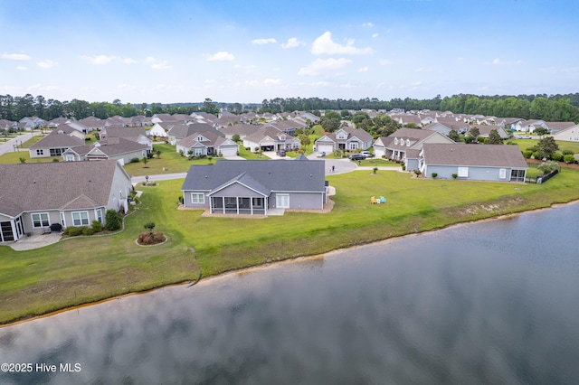 aerial view of residential area with a nearby body of water