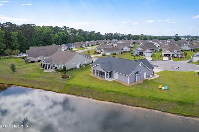 aerial perspective of suburban area with a large body of water