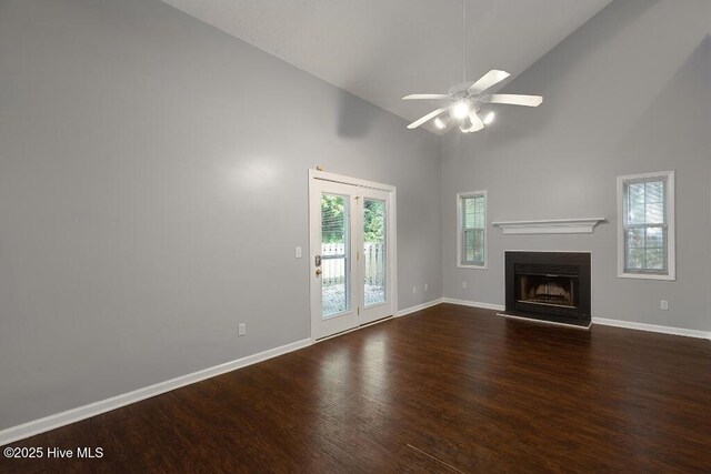 5126 Lamppost Cir, Wilmington, NC 28403 - unfurnished living room with dark wood finished floors, baseboards, high vaulted ceiling, a ceiling fan, and a fireplace
