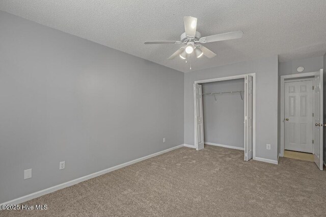 5126 Lamppost Cir, Wilmington, NC 28403 - unfurnished bedroom with a textured ceiling, carpet floors, a closet, baseboards, and ceiling fan