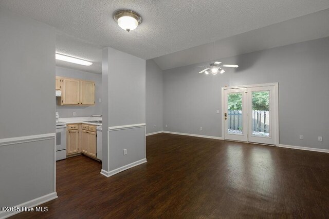 5126 Lamppost Cir, Wilmington, NC 28403 - unfurnished living room with a ceiling fan, dark wood-style floors, baseboards, a textured ceiling, and vaulted ceiling