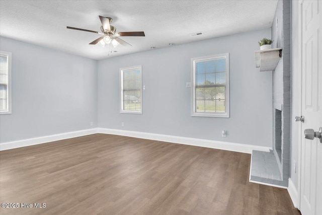 235 Zachary Ln, Hubert, NC 28539 - spare room featuring a ceiling fan, wood finished floors, healthy amount of natural light, and baseboards