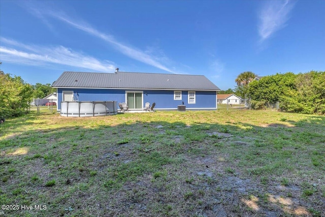 235 Zachary Ln, Hubert, NC 28539 - rear view of house with metal roof