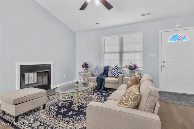 235 Zachary Ln, Hubert, NC 28539 - living room with ceiling fan, vaulted ceiling, a fireplace, and baseboards