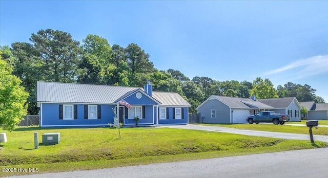 235 Zachary Ln, Hubert, NC 28539 - ranch-style house with concrete driveway, metal roof, and a chimney