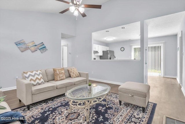 235 Zachary Ln, Hubert, NC 28539 - living area with a ceiling fan, baseboards, and wood finished floors