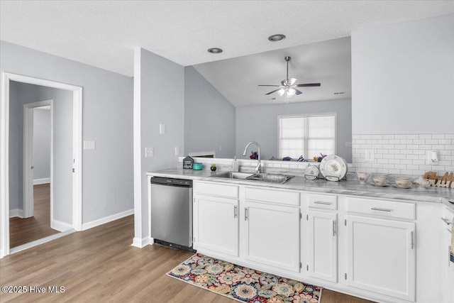 235 Zachary Ln, Hubert, NC 28539 - kitchen featuring dishwasher, a sink, ceiling fan, light wood finished floors, and lofted ceiling