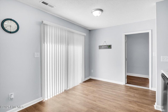 235 Zachary Ln, Hubert, NC 28539 - spare room with wood finished floors, baseboards, and a textured ceiling