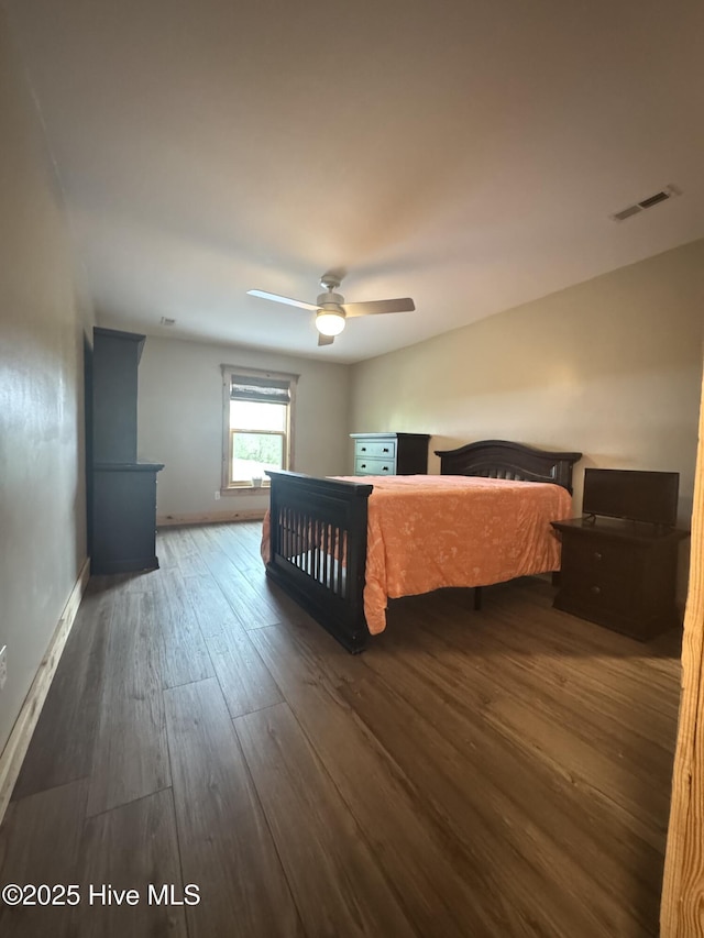 200 Wintergreen Patch Ln, Burnsville, NC 28714 - bedroom with wood finished floors, baseboards, and ceiling fan
