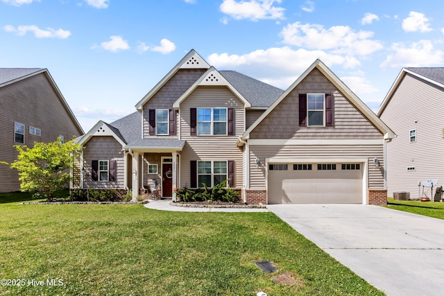 203 Holmes Point Ct, Jacksonville, NC 28546 - craftsman-style home featuring an attached garage, driveway, a front lawn, and brick siding