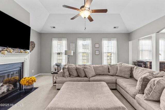 203 Holmes Point Ct, Jacksonville, NC 28546 - living area with light carpet, ceiling fan, a fireplace with flush hearth, vaulted ceiling, and baseboards