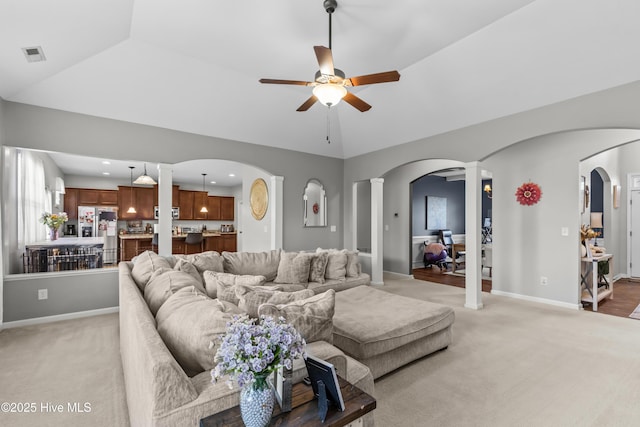 203 Holmes Point Ct, Jacksonville, NC 28546 - living area with decorative columns, ceiling fan, arched walkways, and light carpet