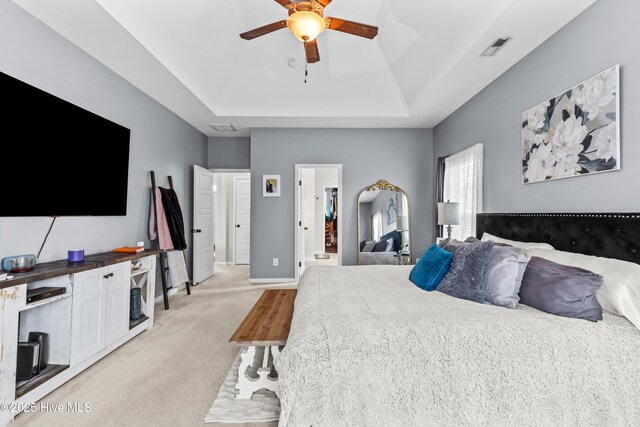 203 Holmes Point Ct, Jacksonville, NC 28546 - bedroom with a raised ceiling, light colored carpet, baseboards, and ceiling fan