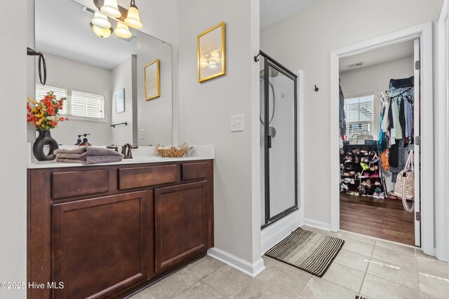 203 Holmes Point Ct, Jacksonville, NC 28546 - full bath with tile patterned flooring, plenty of natural light, a stall shower, and vanity