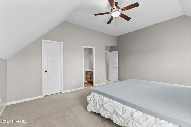 203 Holmes Point Ct, Jacksonville, NC 28546 - bedroom with vaulted ceiling, carpet, baseboards, ensuite bathroom, and ceiling fan