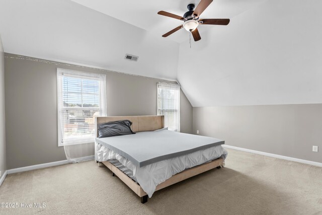203 Holmes Point Ct, Jacksonville, NC 28546 - bedroom featuring vaulted ceiling, baseboards, light carpet, and ceiling fan