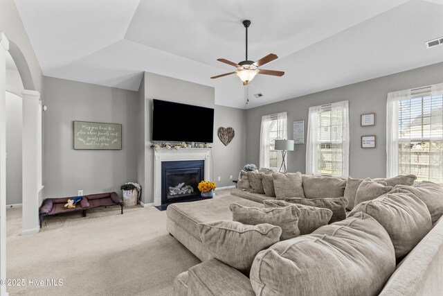203 Holmes Point Ct, Jacksonville, NC 28546 - living area featuring a fireplace with flush hearth, ceiling fan, carpet flooring, and baseboards