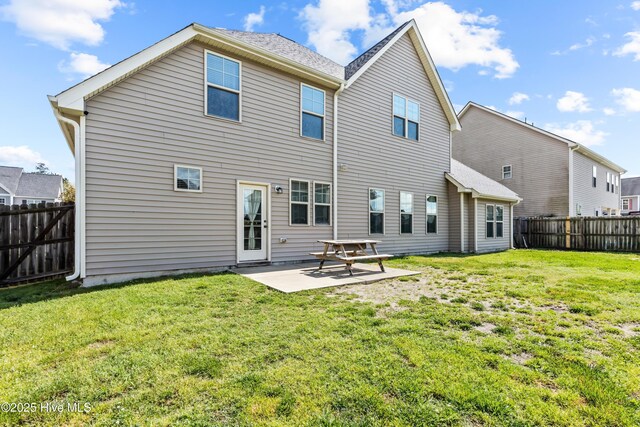 203 Holmes Point Ct, Jacksonville, NC 28546 - rear view of house with a patio
