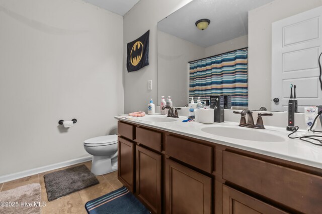 203 Holmes Point Ct, Jacksonville, NC 28546 - full bathroom featuring toilet, tile patterned floors, double vanity, a shower with shower curtain, and baseboards