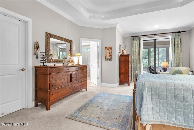 bedroom with light carpet, ornamental molding, baseboards, access to exterior, and a tray ceiling