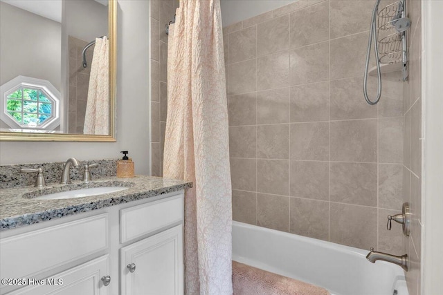 bathroom featuring shower / bath combo with shower curtain and vanity