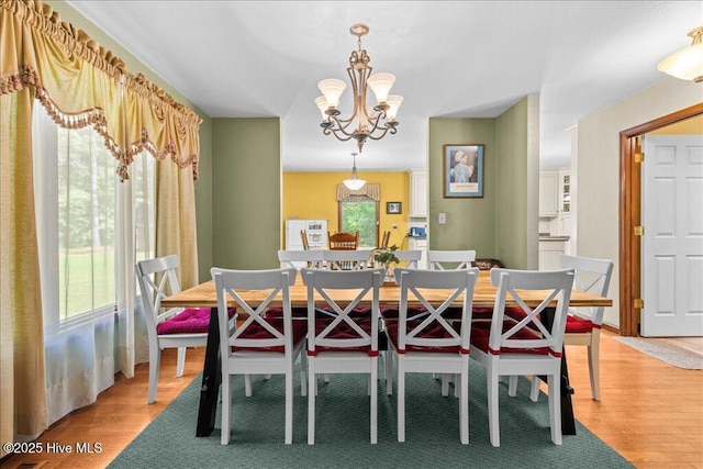 476 Paige Riddick Rd, Gates, NC 27937 - dining area featuring light wood-style floors and a chandelier