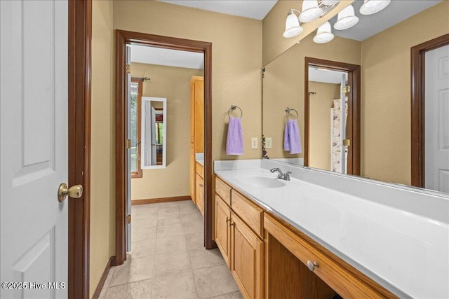476 Paige Riddick Rd, Gates, NC 27937 - bathroom featuring vanity, baseboards, and tile patterned flooring