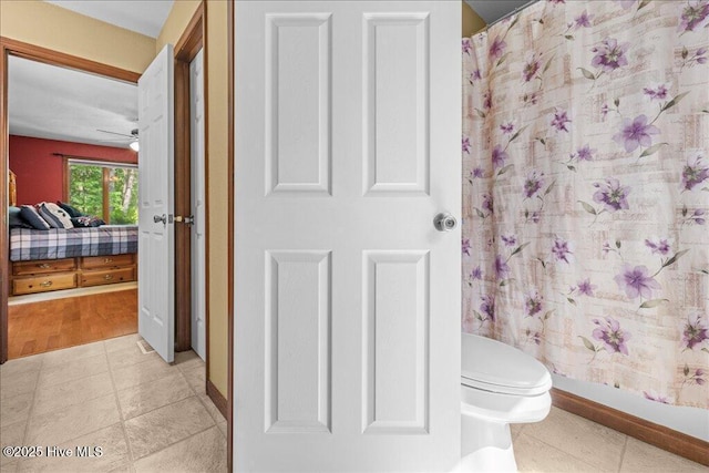 476 Paige Riddick Rd, Gates, NC 27937 - full bath featuring toilet, a shower with shower curtain, ensuite bath, baseboards, and a ceiling fan