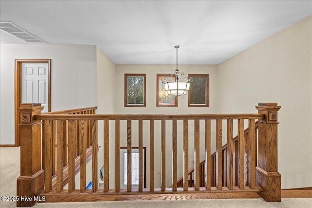 476 Paige Riddick Rd, Gates, NC 27937 - stairs with carpet floors, a chandelier, and baseboards