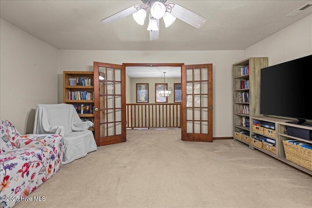 476 Paige Riddick Rd, Gates, NC 27937 - living area featuring french doors, carpet, ceiling fan, and baseboards