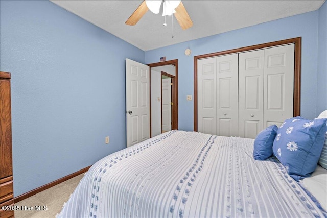 476 Paige Riddick Rd, Gates, NC 27937 - carpeted bedroom with a closet, a ceiling fan, and baseboards