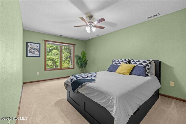 476 Paige Riddick Rd, Gates, NC 27937 - bedroom with baseboards, carpet, and a ceiling fan