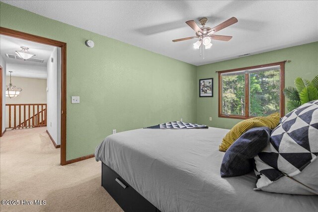 476 Paige Riddick Rd, Gates, NC 27937 - bedroom with light colored carpet, ceiling fan, and baseboards