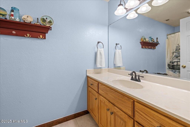 476 Paige Riddick Rd, Gates, NC 27937 - bathroom featuring baseboards, tile patterned floors, and vanity