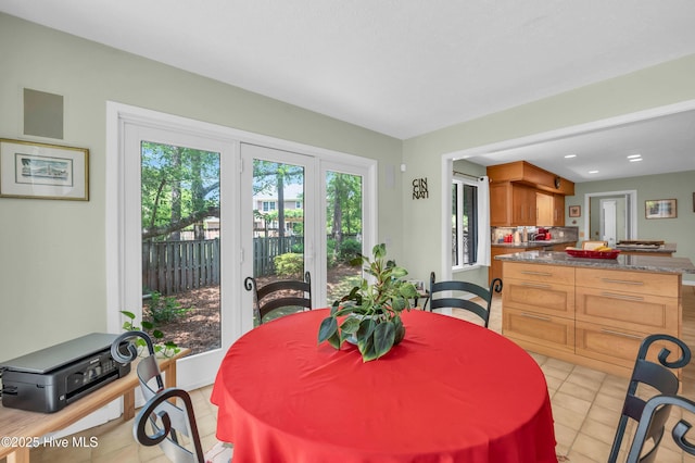 dining area featuring light tile patterned floors