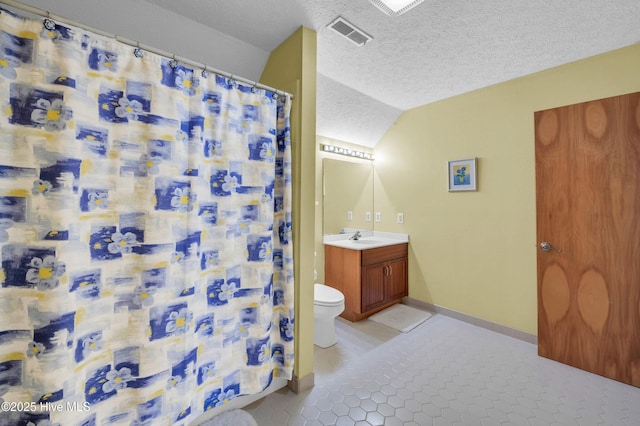 full bathroom with vaulted ceiling, vanity, a textured ceiling, toilet, and curtained shower
