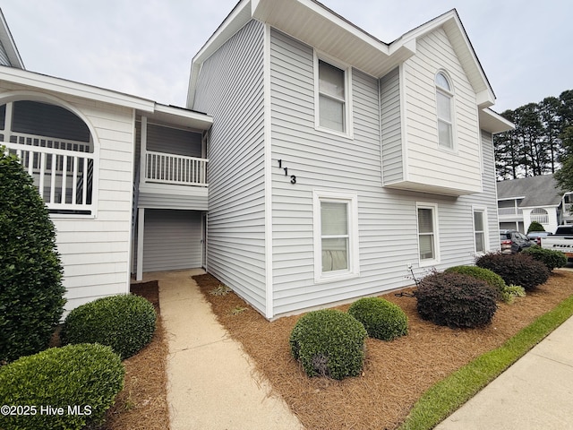 view of property exterior featuring a balcony