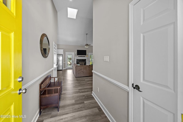 306 Channel Run Dr, New Bern, NC 28562 - hallway featuring high vaulted ceiling, wood finished floors, a skylight, and baseboards