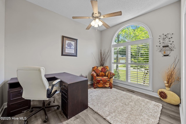 306 Channel Run Dr, New Bern, NC 28562 - home office featuring ceiling fan, a textured ceiling, wood finished floors, and baseboards