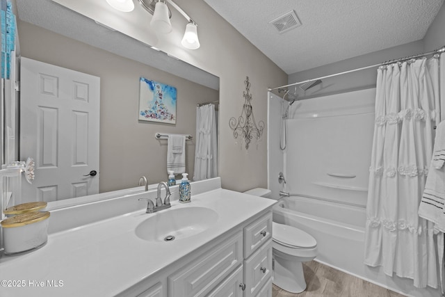 306 Channel Run Dr, New Bern, NC 28562 - full bath with toilet, vanity, shower / bath combo with shower curtain, a textured ceiling, and wood finished floors