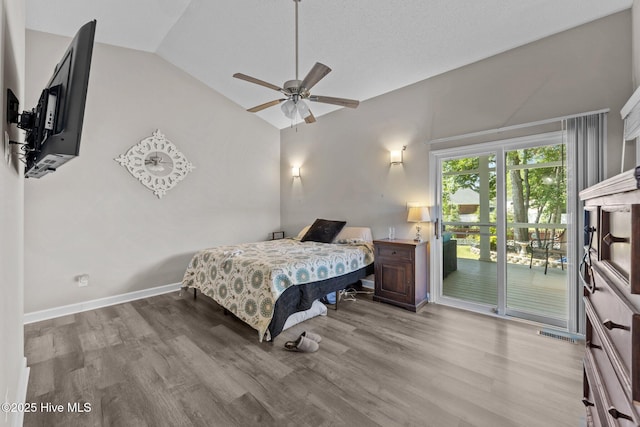 306 Channel Run Dr, New Bern, NC 28562 - bedroom featuring access to exterior, lofted ceiling, wood finished floors, and baseboards