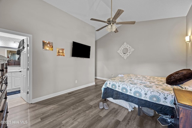 306 Channel Run Dr, New Bern, NC 28562 - bedroom with wood finished floors, vaulted ceiling, baseboards, ensuite bath, and a ceiling fan