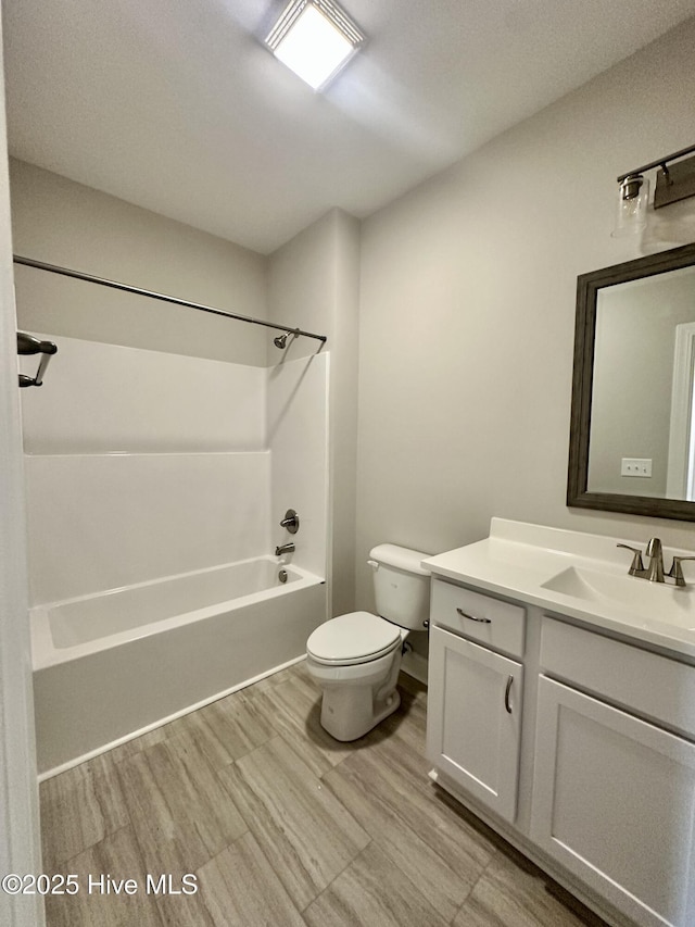 full bathroom with toilet, tub / shower combination, and vanity