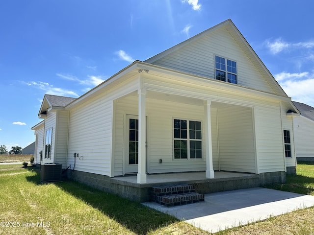 view of front of property with a porch and central AC